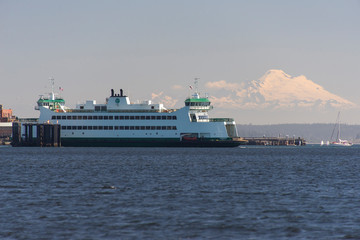 USA, Washington State. Ferry arrives at Port Townsend from Whidbey Island, with Mount Baker in background.