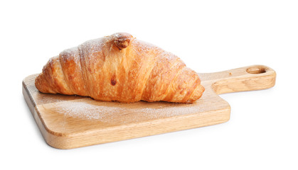 Wooden board with tasty croissant and powdered sugar on white background. French pastry
