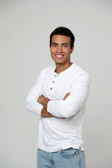 Handsome young African-American man on light background