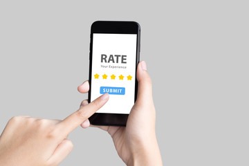 hand holding phone and give 5 star rate experience on grey background with clipping path