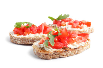 Delicious tomato bruschettas on white background. Traditional Italian antipasto