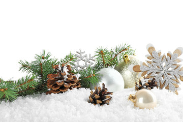 Christmas decoration on snow against white background