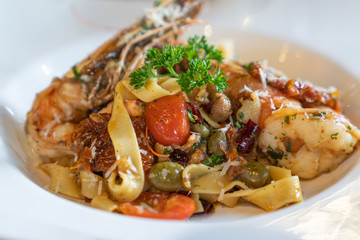 Delicious fresh spaghetti seafood with big shrimp dipping.
