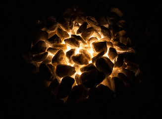 The original garden lamp shines from bottom to top at ground level.