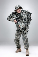 Armed soldier holding a rifle.