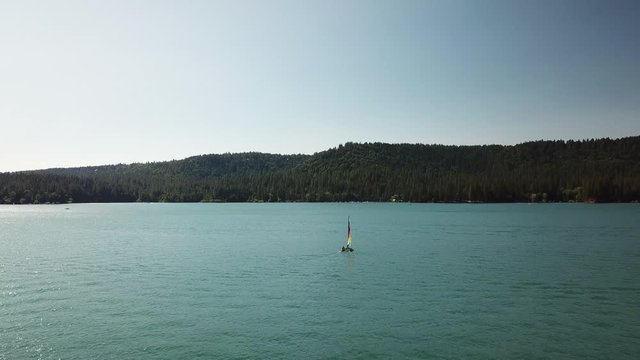 Drone shot of Lone Rainbow Sail boat in California
