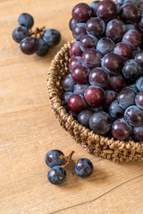fresh black grapes on white background