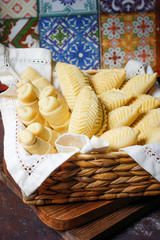 Traditional Azerbaijan holiday Novruz cookies baklava on white plate on the white background with nuts and shakarbura,tea,lemon,kata,mutaki,flat lay,top view,space for copy