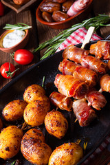 Rustic dates wrapped in bacon and young roasted potato.