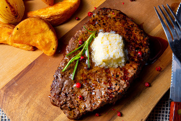 Butter Beef Steak with herbs and potato wedges