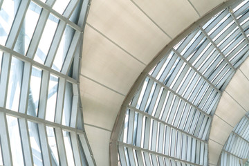 Steel structure of modern office building roof. Metal windows glass facade frames supported. Abstract interior architecture design decoration background.