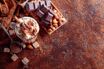 Hot chocolate with cream sprinkled with chocolate chips.