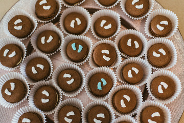 french macaroons cookies decorated with baby feet