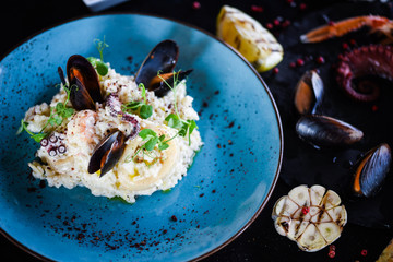 risotto with fresh seafood & shrimps, shells, octopus, calamari 