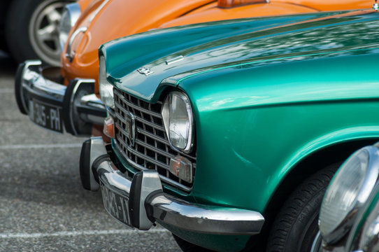 Closeup of green Peugeot 204 parked in vintage exhibition cars