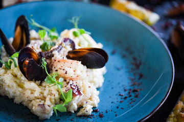 risotto with fresh seafood & shrimps, shells, octopus, calamari 