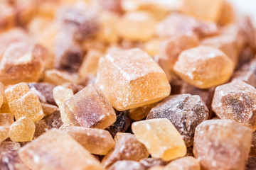 Cane sugar in crystal cubes, fragrant brown sugar for tea and coffee