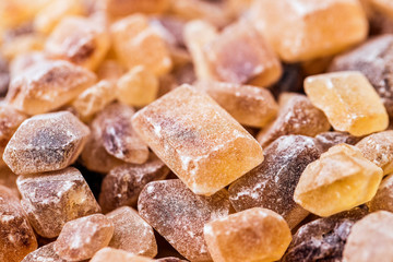 Cane sugar in crystal cubes, fragrant brown sugar for tea and coffee