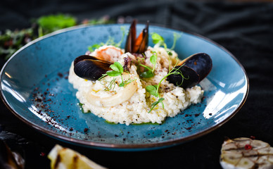 risotto with fresh seafood & shrimps, shells, octopus, calamari 