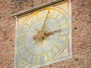 Fototapeta na wymiar Verona, Italy - July, 29, 2019: clock on a tower in Verona, Italy