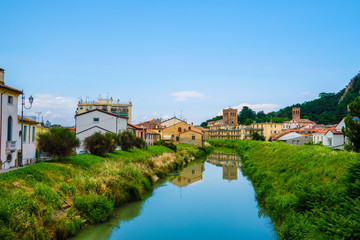 Fototapeta na wymiar Monseliche, Italy - July, 14, 2019: Landscape with the image of channel in Monseliche, Italy
