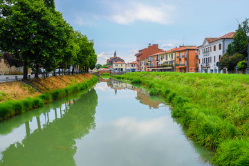 Fototapeta na wymiar Monseliche, Italy - July, 14, 2019: Landscape with the image of channel in Monseliche, Italy