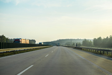 Warshaw, Poland - July, 26, 2019: landscape with the image of a road in Poland at sunset