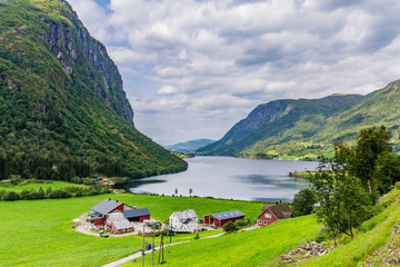 Mountain panorama with typical Norwegian wooden farmhouse in Forde in Sogn og Fjorden county in...