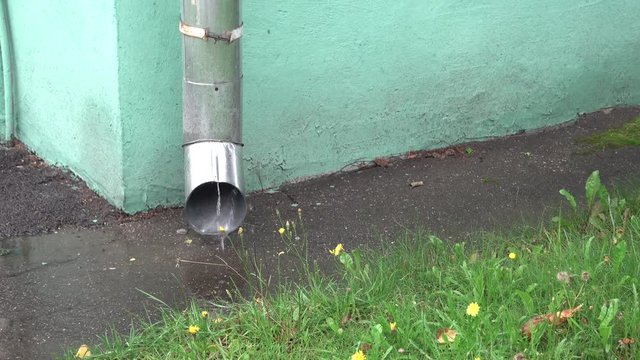 Rain water running through downpipe