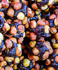 Slices of marmalade with hazelnuts. Hazelnut with sweets.