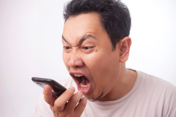 Young Man Getting Bad News on Phone, Shocked and Angry