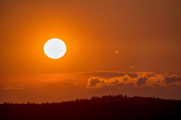A beautiful sunrise with a golden sunshine on a late summer evening. Concept: landscape or sunset