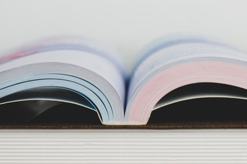 Open textbook for reading in library or classroom on wooden desk, free time or hobby and relax with...
