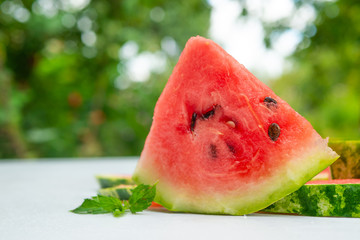 slices of fresh watermelon on nature background 