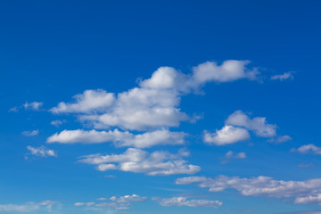 spindrift clouds in summer  , blue sky background