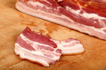 slices of ham on wooden board