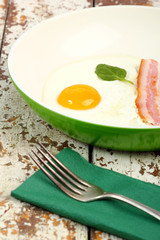 fried egg with bacon and eggs