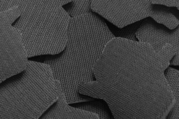 Velcro patch on pattern.Velcro texture. Black fabric background. Extreme close-up.
