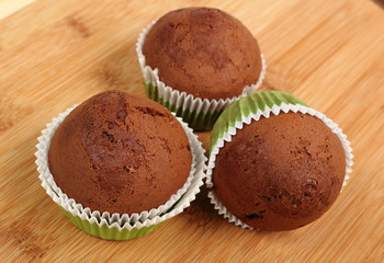 chocolate muffins on wooden table