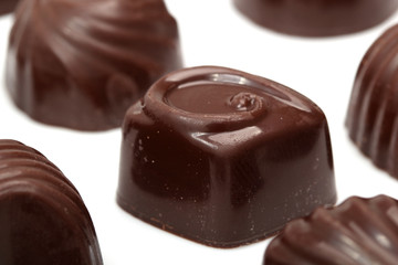 chocolate candies on white background