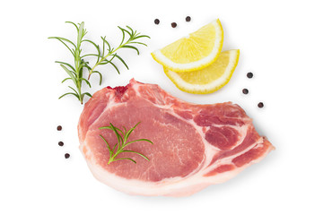 sliced raw pork meat with rosemary and lemon isolated on white background with copy space for your text. Top view. Flat lay