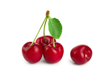 Sweet red cherries with leaves isolated on white background macro