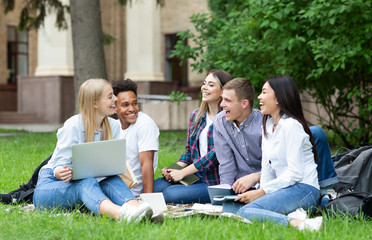 University students studying together on campus ground