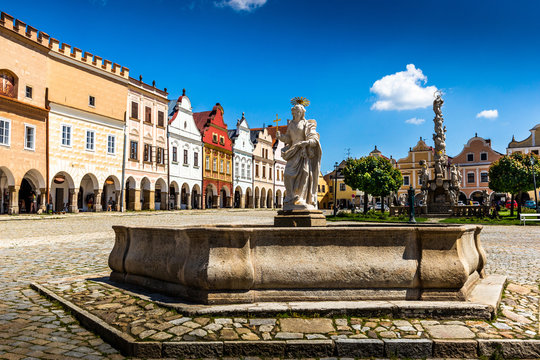 Main square of Telc city, a UNESCO World Heritage Site, on a sunny day with blue sky and clouds, South Moravia, Czech Republic.