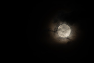 Moon light behind cloud