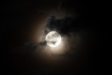 Moon light behind cloud