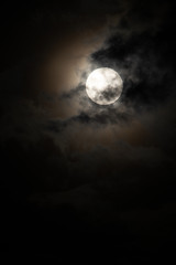 Moon light behind cloud