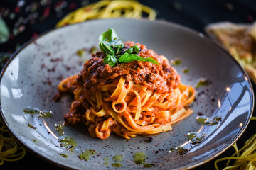 delicious italian spaghetti bolognese with minced beef sauce, tomatoes, carrots & fresh basil 
