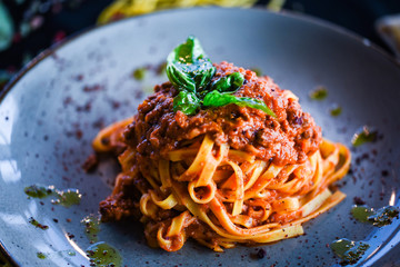 delicious italian spaghetti bolognese with minced beef sauce, tomatoes, carrots & fresh basil 