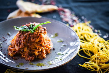 delicious italian spaghetti bolognese with minced beef sauce, tomatoes, carrots & fresh basil 